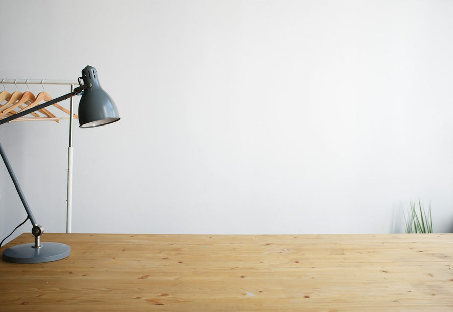 Grey balanced-arm desk lamp